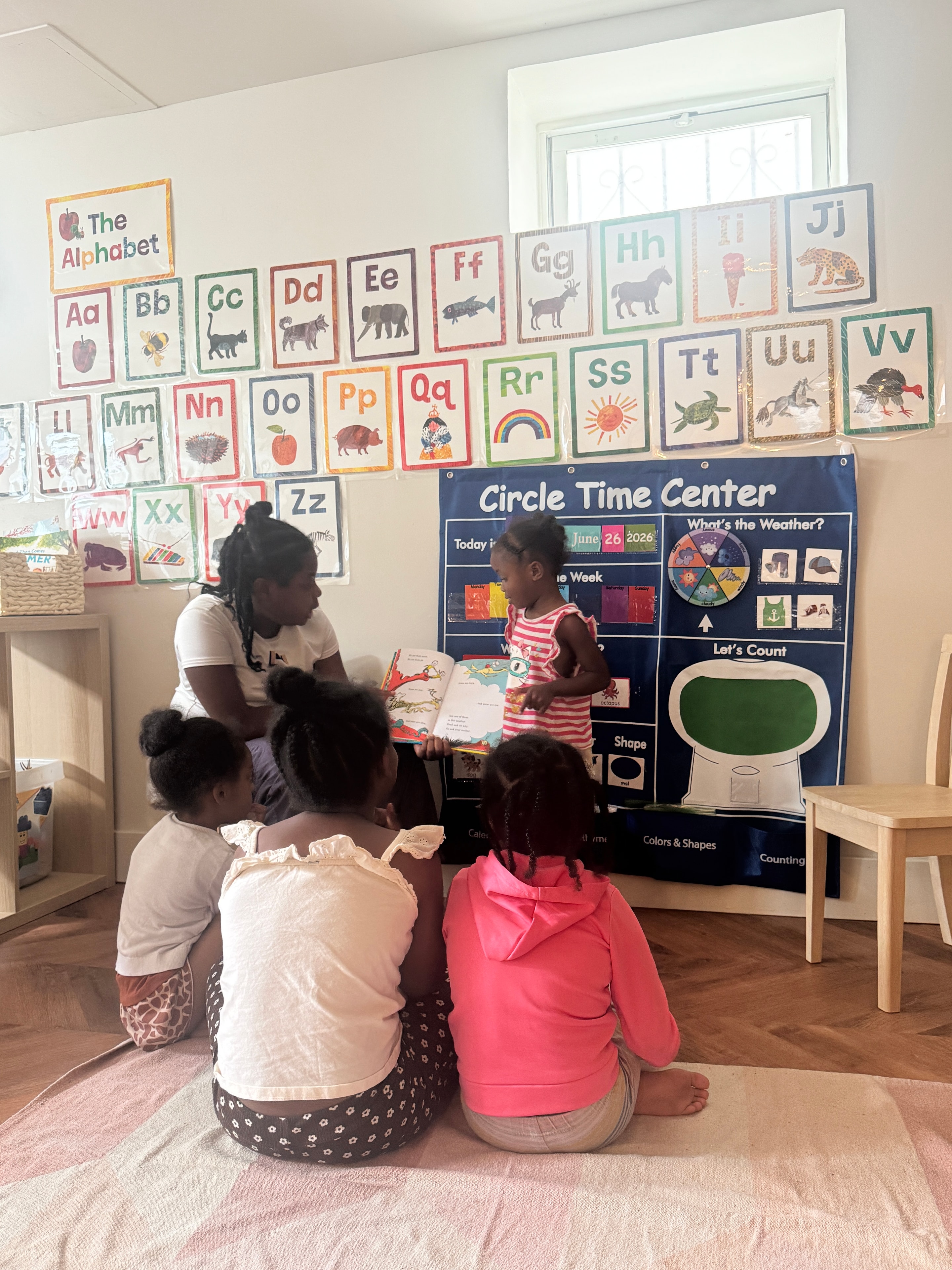 Scholar 2 Bee caregiver with children in a nurturing home setting